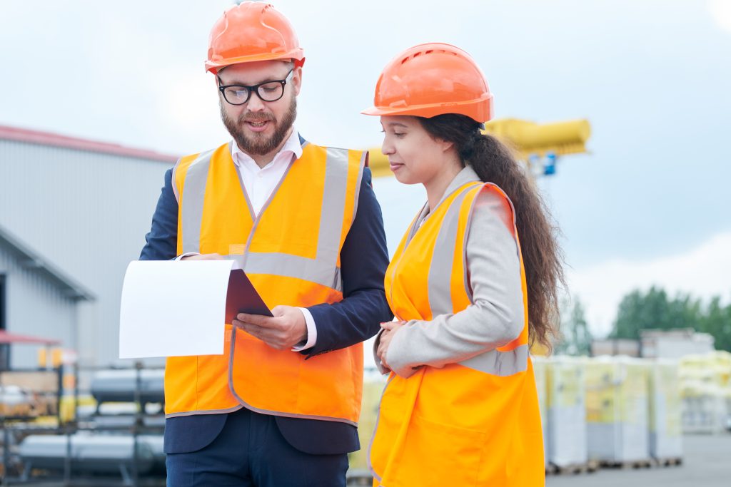 Construction Foreman Instructing Worker